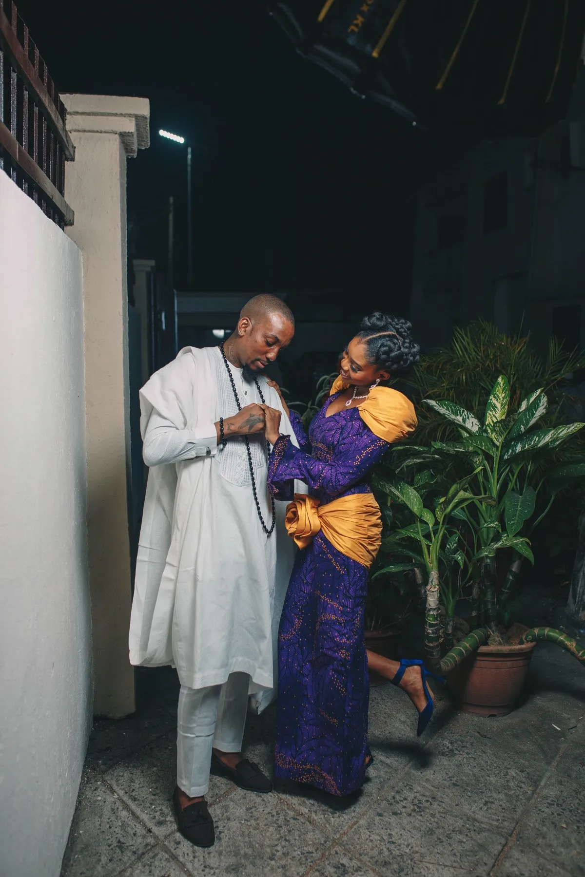 ekanem and adeilé laughing together in the garden at night
